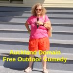 Tessa on the seating at Auckland Domain's Grandstand with mic in hand